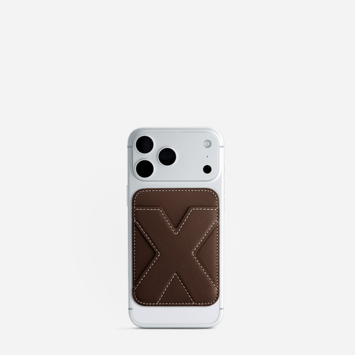 MagSafe cardholder in Espresso, initial X, on phone