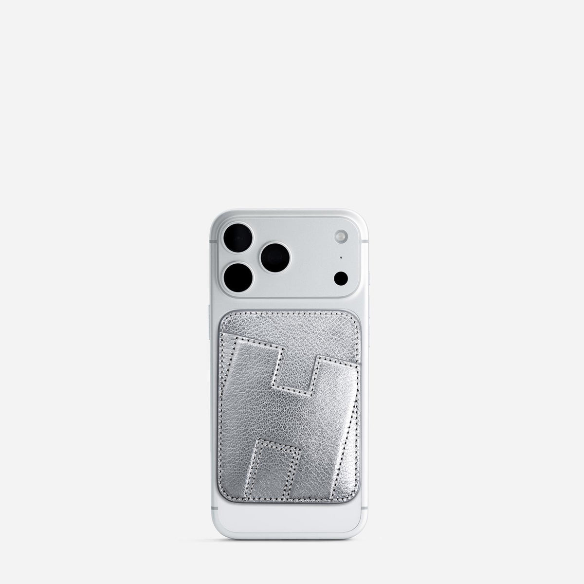 MagSafe cardholder in Metallic Silver, initial H, on phone