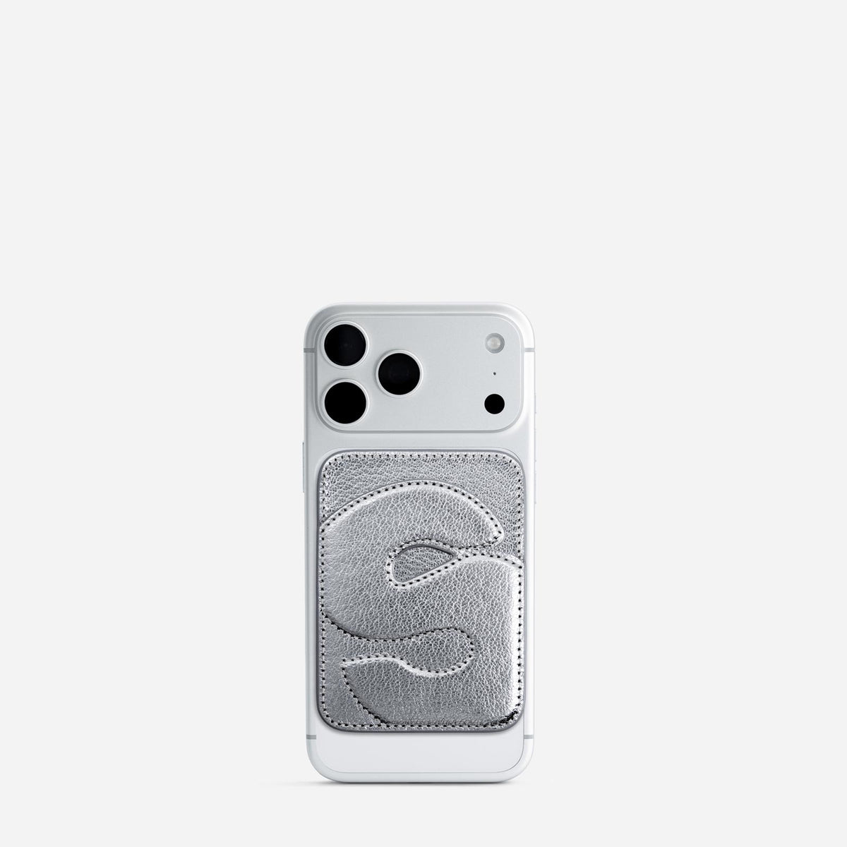 MagSafe cardholder in Metallic Silver, initial S, on phone