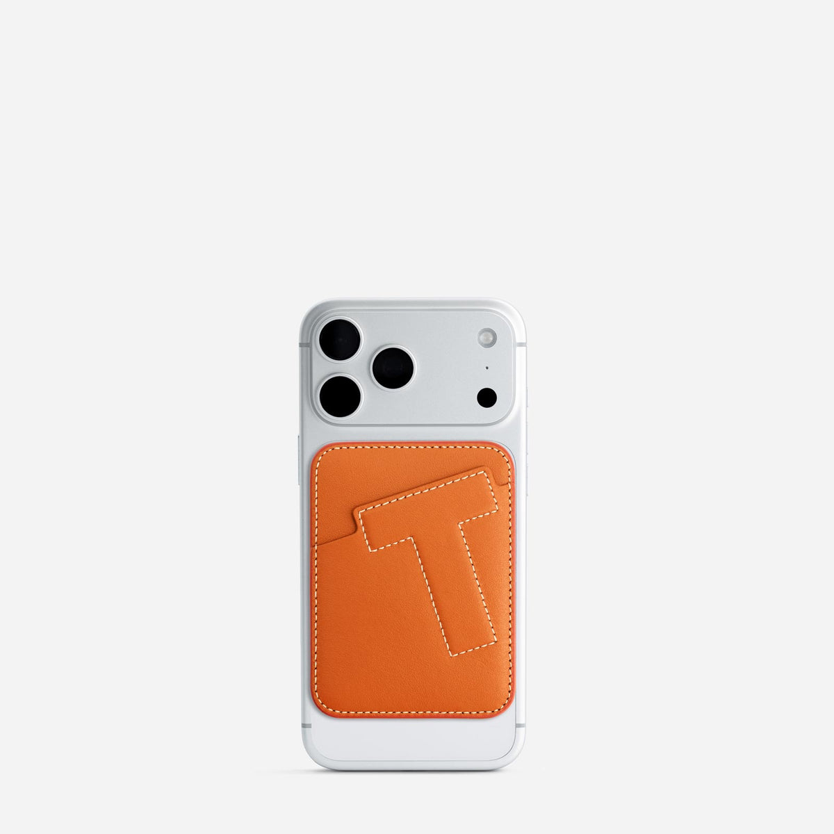 MagSafe cardholder in Orange, initial T, on phone